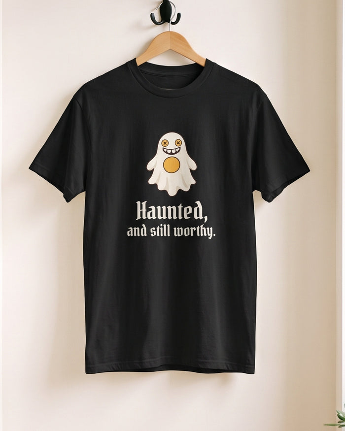 Haunted and Still Worthy tee, on a hanger